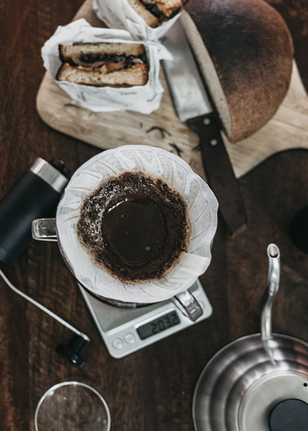 coffee in paper filter of a coffee dripper